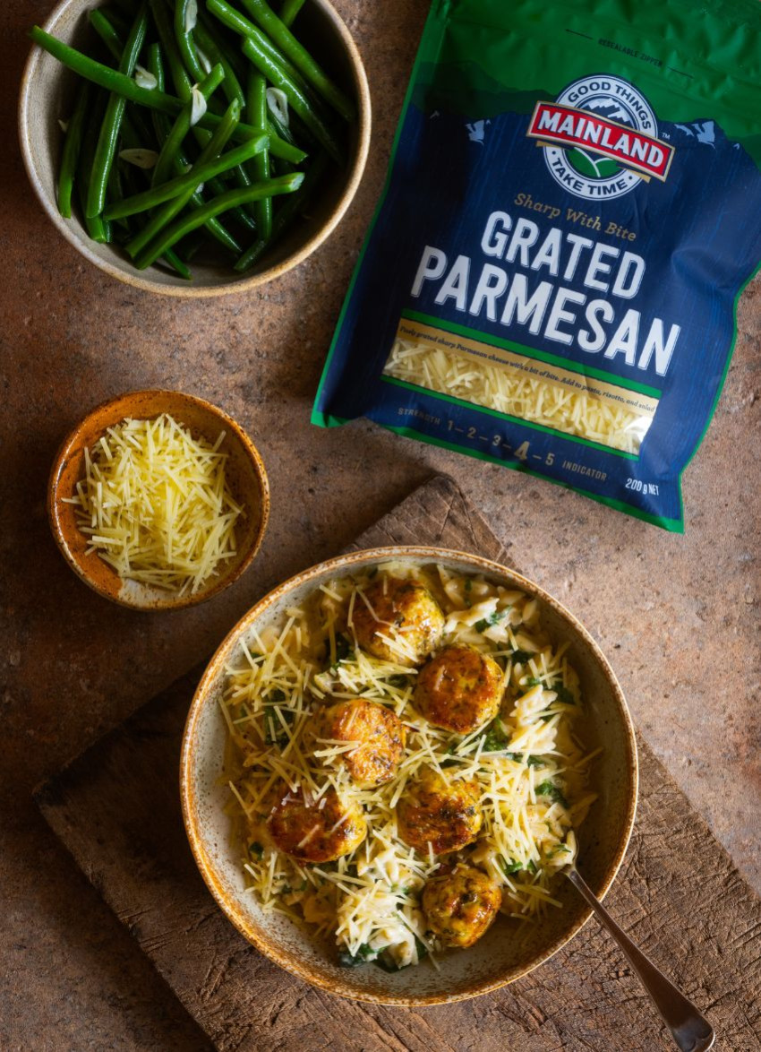 Juicy chicken meatballs served with creamy orzo in a bowl