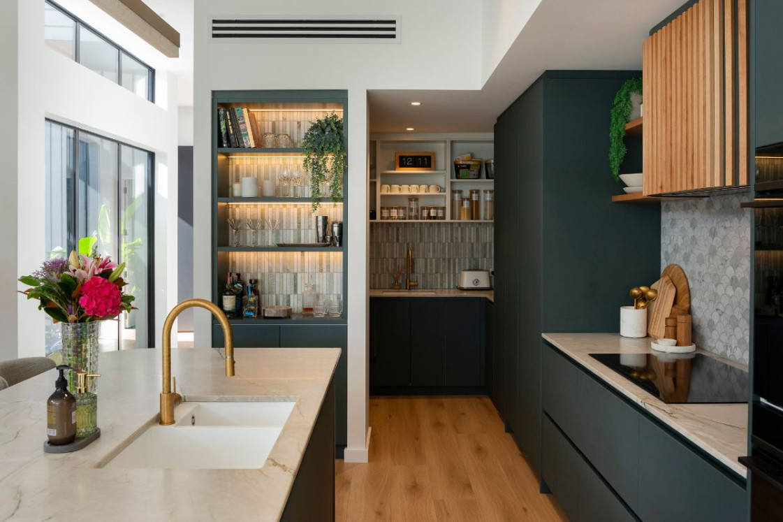 Kitchen cabinets painted in Resene Holly paired with natural wood accents